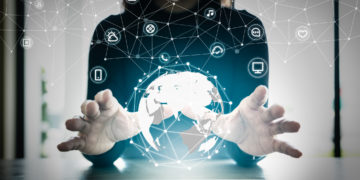 Close up hand's woman over digital planet global connection with communication network application icon,  internet of things (IoT) and Digital era. Marketing 4.0