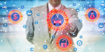 Unrecognizable industrial consultant is presenting a cyber-hijacking attack on autonomous control system for transportation. IT concept for cybercrime aimed at the internet of things and ransomware.
