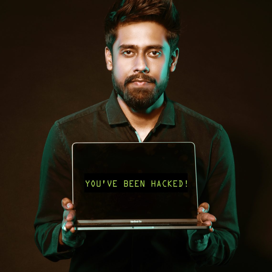 Photo by Saksham Choudhary from Pexels: https://www.pexels.com/photo/man-holding-laptop-computer-with-both-hands-2036656/