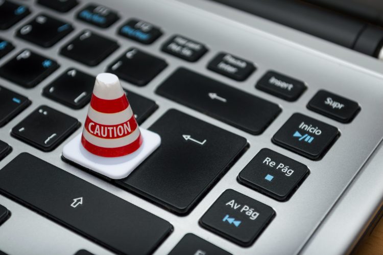 Photo by Fernando Arcos from Pexels: https://www.pexels.com/photo/white-caution-cone-on-keyboard-211151/