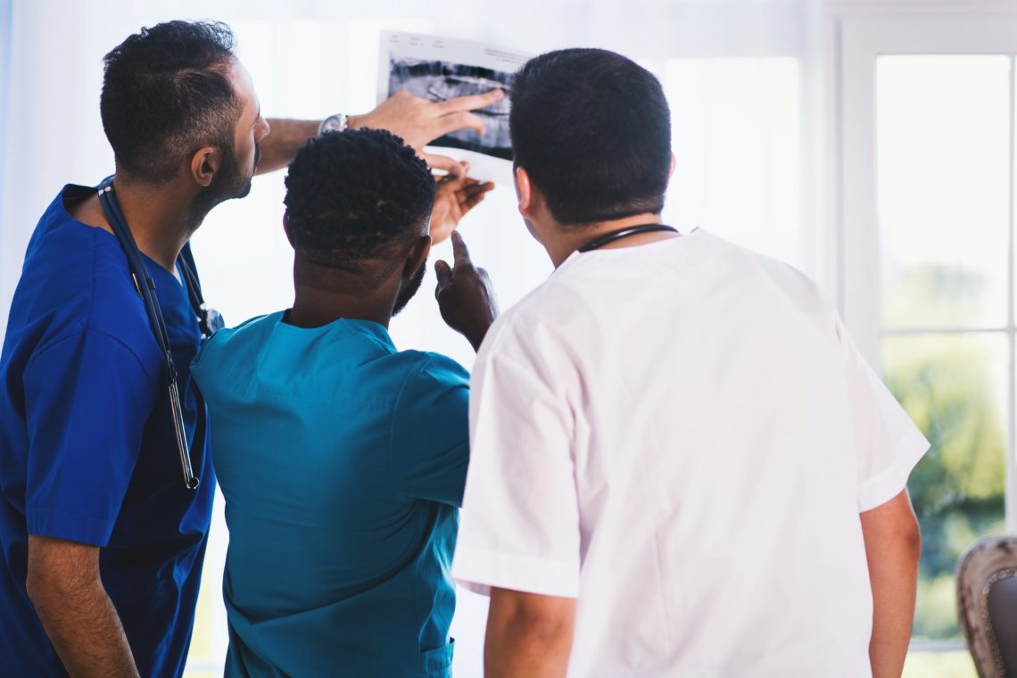 Photo by EVG Kowalievska from Pexels: https://www.pexels.com/photo/three-person-looking-at-x-ray-result-1170979/