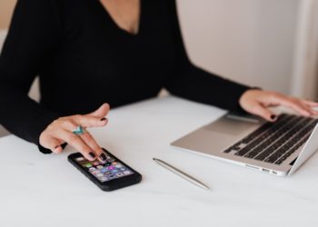 Photo by Karolina Grabowska from Pexels: https://www.pexels.com/photo/crop-woman-using-smartphone-and-laptop-during-work-in-office-4467737/