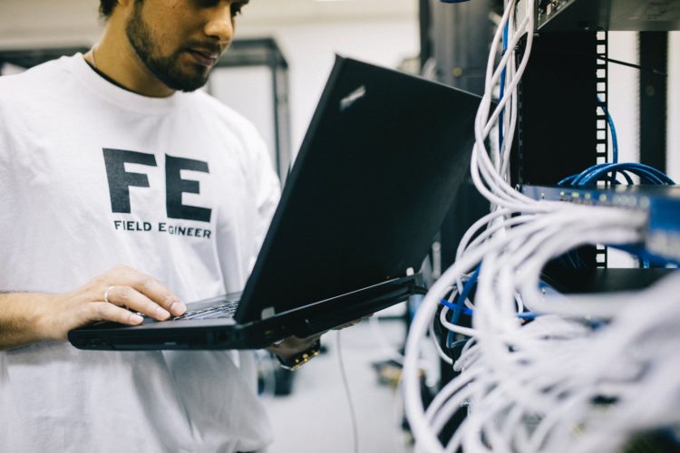 Photo by Field Engineer from Pexels: https://www.pexels.com/photo/serious-ethnic-field-engineer-examining-hardware-and-working-on-laptop-442152/