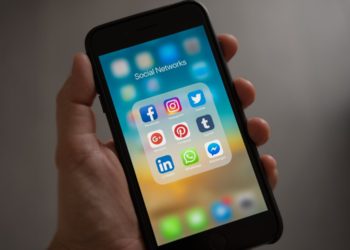 Photo by Tracy Le Blanc from Pexels: https://www.pexels.com/photo/person-holding-iphone-showing-social-networks-folder-607812/