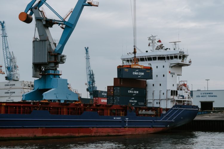 Photo by Kai Pilger: https://www.pexels.com/photo/blue-and-red-cargo-ship-with-crane-1544372/