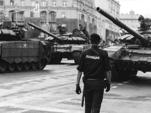 Photo by Kris Møklebust from Pexels: https://www.pexels.com/photo/policeman-walking-near-tanks-5764701/