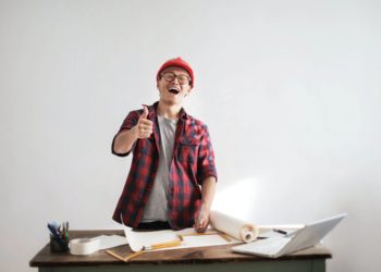 Photo by Andrea Piacquadio from Pexels: https://www.pexels.com/photo/laughing-male-constructor-showing-thumb-up-at-working-desk-3760613/