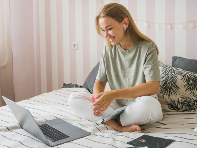 Photo by Tima Miroshnichenko from Pexels: https://www.pexels.com/photo/woman-in-green-shirt-sitting-on-bed-using-laptop-4908721/
