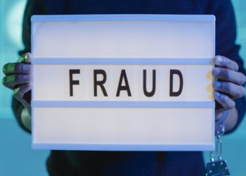 Photo by Tima Miroshnichenko from Pexels: https://www.pexels.com/photo/a-person-with-handcuffs-holding-a-sign-that-says-fraud-6266506/