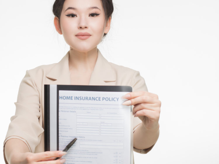 Photo by Mikhail Nilov from Pexels: https://www.pexels.com/photo/woman-in-corporate-attire-holding-a-home-insurance-policy-7736070/