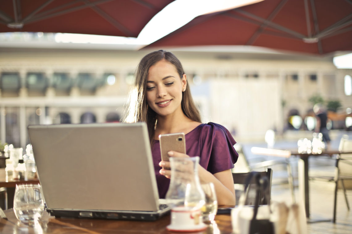 Photo by Andrea Piacquadio from Pexels: https://www.pexels.com/photo/woman-wearing-purple-shirt-holding-smartphone-white-sitting-on-chair-826349/