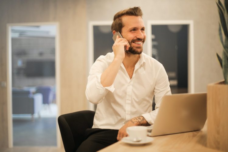 Photo by Andrea Piacquadio from Pexels: https://www.pexels.com/photo/smiling-formal-male-with-laptop-chatting-via-phone-3760263/