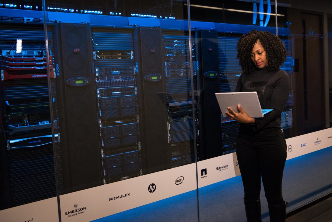 Photo by Christina Morillo from Pexels: https://www.pexels.com/photo/software-engineer-standing-beside-server-racks-1181354/