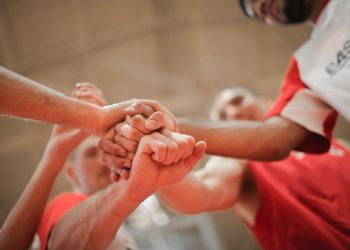 Photo by Andrea Piacquadio: https://www.pexels.com/photo/basketball-team-stacking-hands-together-3755440/