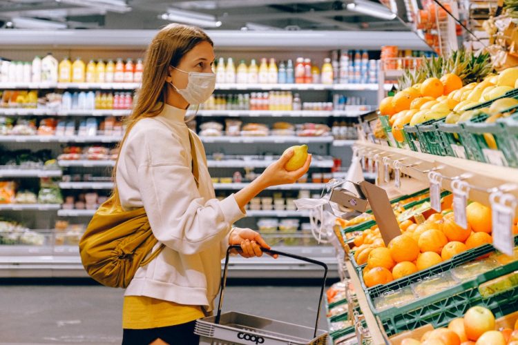 Photo by Anna Shvets from Pexels: https://www.pexels.com/photo/woman-in-yellow-tshirt-and-beige-jacket-holding-a-fruit-stand-3962285/