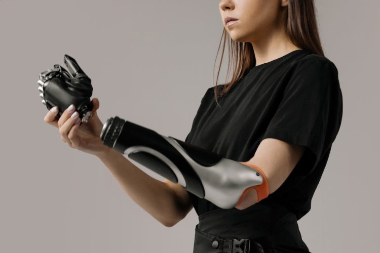 Photo by cottonbro: https://www.pexels.com/photo/woman-in-black-t-shirt-holding-black-and-white-leather-gloves-6153115/