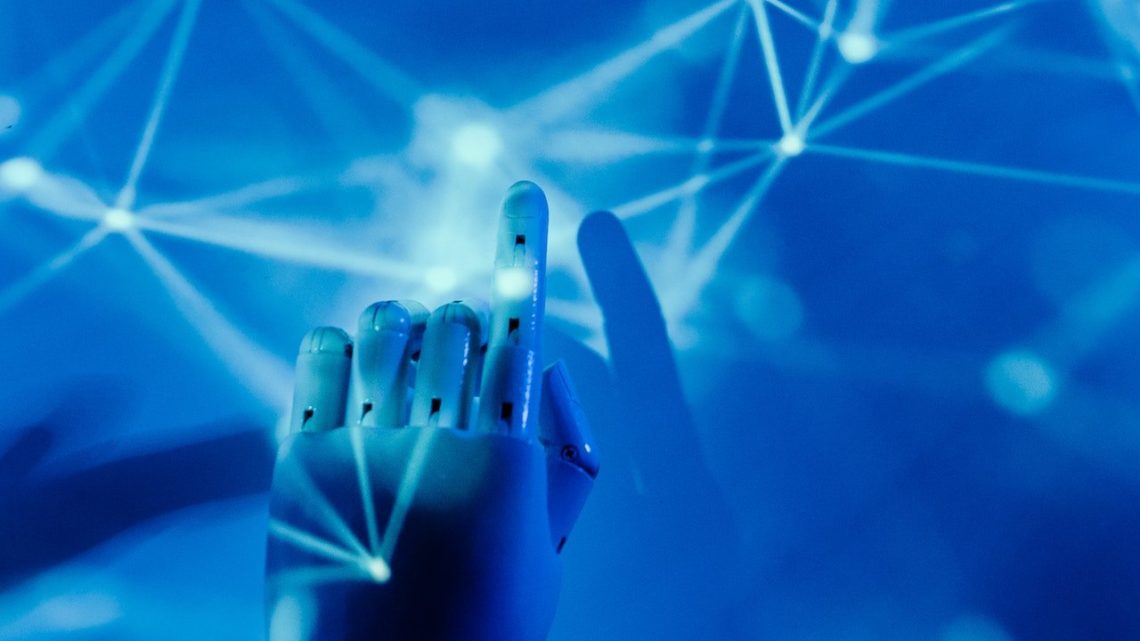 Photo by Tara Winstead: https://www.pexels.com/photo/robot-s-hand-on-a-blue-background-8386437/