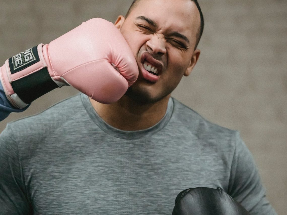 Photo by Julia Larson : https://www.pexels.com/photo/unrecognizable-boxer-hitting-young-ethnic-sportsman-during-training-6456268/