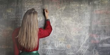 Photo by Andrea Piacquadio: https://www.pexels.com/photo/woman-in-red-long-sleeve-writing-on-chalk-board-3769714/
