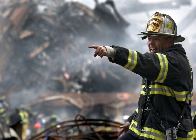Photo by Pixabay: https://www.pexels.com/photo/fire-fighter-wearing-black-and-yellow-uniform-pointing-for-something-70573/