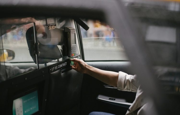Photo by Tim  Samuel: https://www.pexels.com/photo/crop-male-passenger-inserting-card-in-credit-card-reader-in-taxi-5835268/