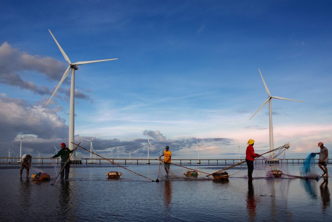 Photo by Tran Le Tuan: https://www.pexels.com/photo/photo-of-fishermen-working-near-wind-turbines-10031163/