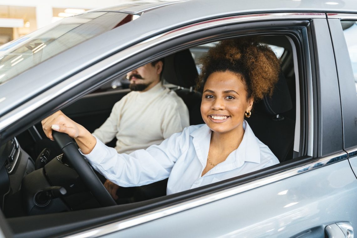 Photo by Antoni Shkraba: https://www.pexels.com/photo/smiling-woman-sitting-inside-the-car-7144214/
