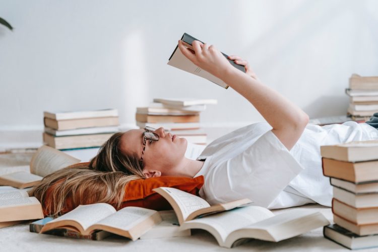 Photo by George Milton: https://www.pexels.com/photo/young-smart-woman-reading-book-on-floor-7034697/