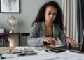 Photo by Tima Miroshnichenko from Pexels: https://www.pexels.com/photo/a-woman-in-plaid-blazer-using-her-laptop-and-mobile-phone-6693656/