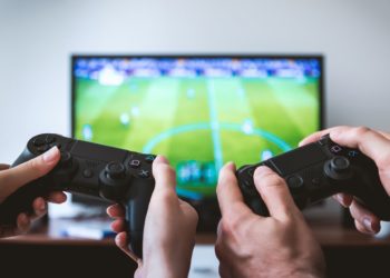 Photo by JESHOOTS.com from Pexels: https://www.pexels.com/photo/two-people-holding-black-gaming-consoles-442576/