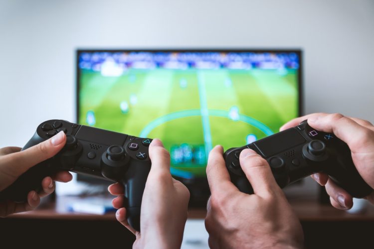 Photo by JESHOOTS.com from Pexels: https://www.pexels.com/photo/two-people-holding-black-gaming-consoles-442576/
