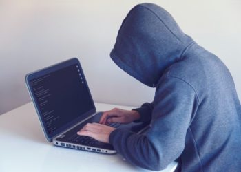 Photo by Nikita Belokhonov: https://www.pexels.com/photo/anonymous-hacker-with-on-laptop-in-white-room-5829726/