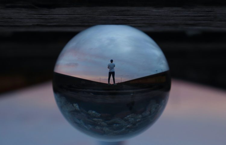 Photo by Jeremy Perkins: https://www.pexels.com/photo/round-glass-ball-reflecting-man-standing-395612/