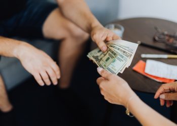 Photo by Karolina Grabowska: https://www.pexels.com/photo/person-giving-money-to-another-person-4968548/