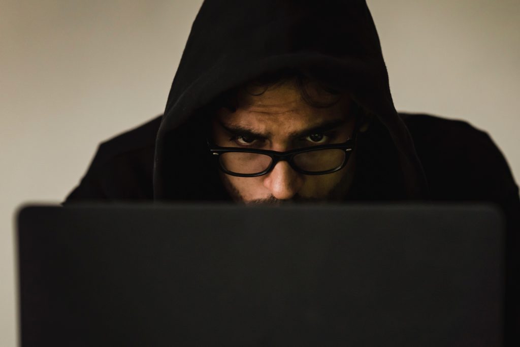 Photo by Sora Shimazaki: https://www.pexels.com/photo/crop-focused-hacker-in-hood-using-laptop-5926386/