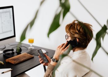 Photo by Karolina Grabowska: https://www.pexels.com/photo/busy-female-talking-on-smartphone-and-checking-messages-during-work-in-contemporary-office-4476635/