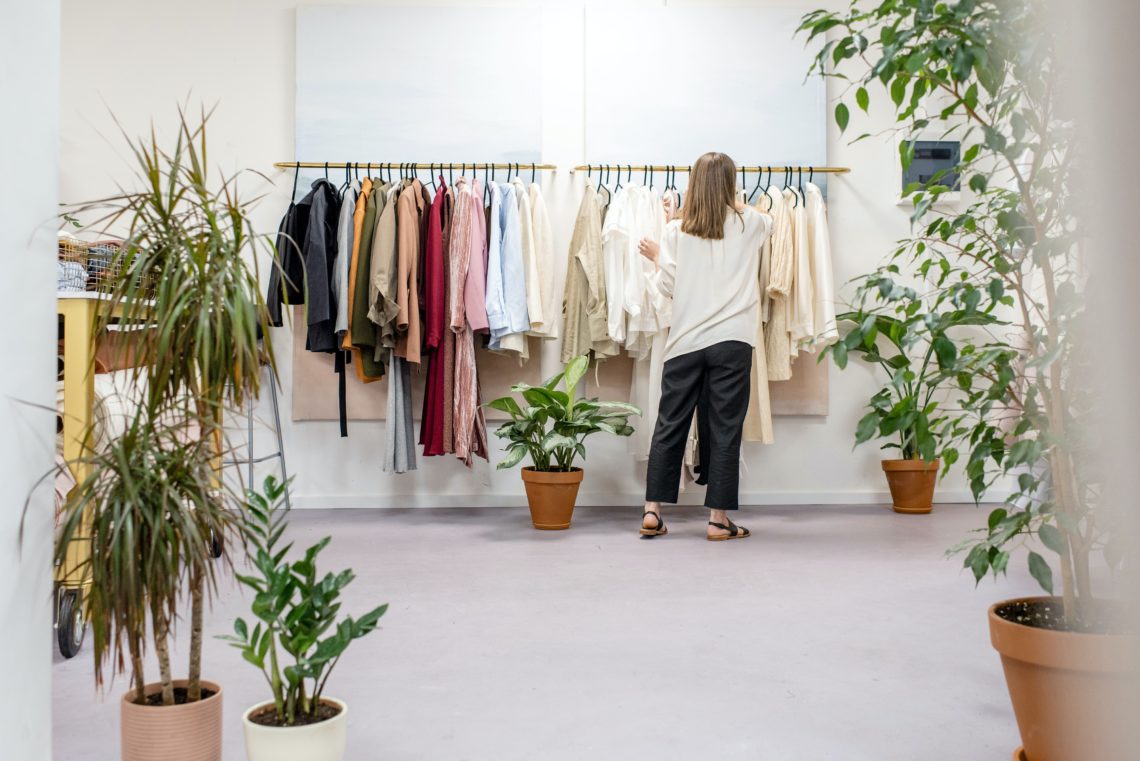 Photo by Ksenia Chernaya: https://www.pexels.com/photo/woman-fixing-clothes-on-the-rack-3965548/