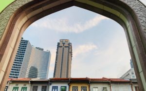 Photo by Shamsuddin Habib: https://www.pexels.com/photo/parkview-square-skyscraper-seen-through-gate-against-blue-sky-in-singapore-18249195/