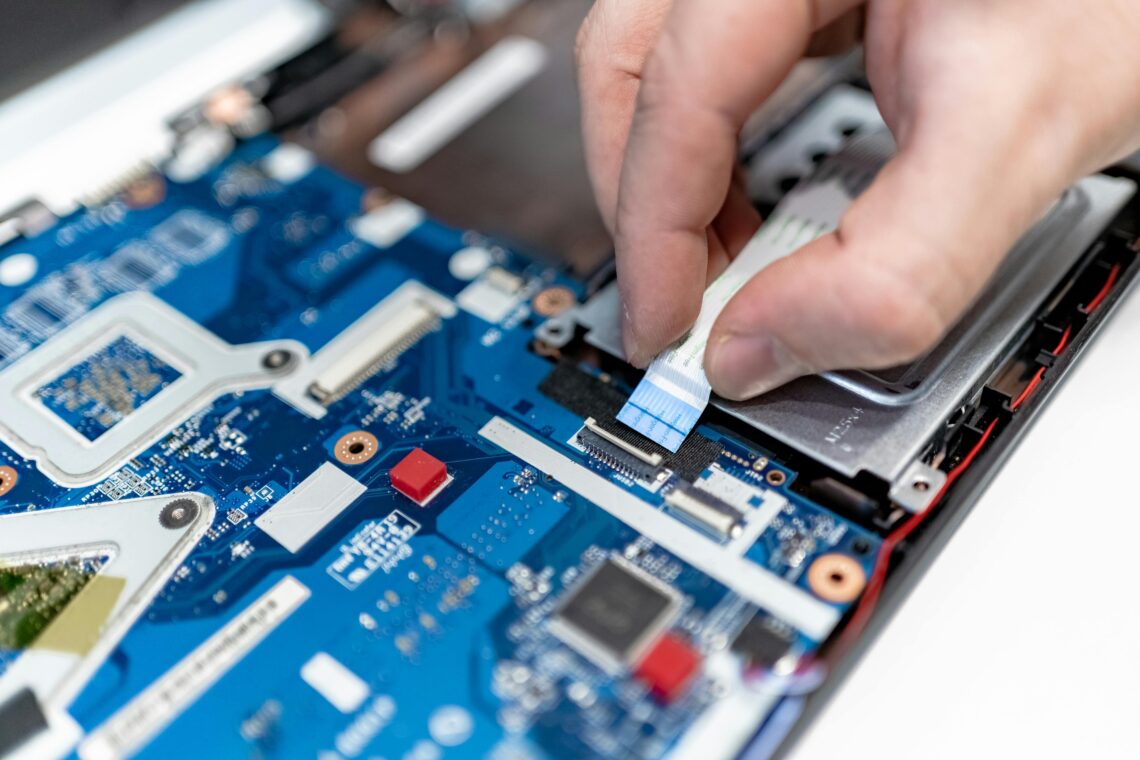 Photo by IT services EU: https://www.pexels.com/photo/close-up-of-man-repairing-a-computer-7639374/