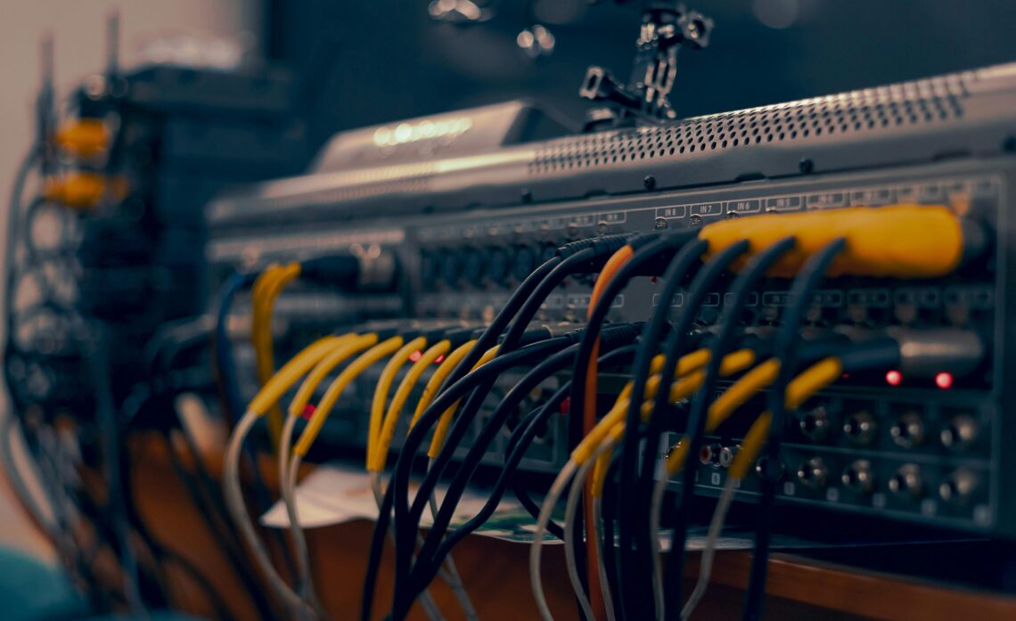 Photo by Jah Nomad: https://www.pexels.com/photo/a-close-up-of-a-computer-with-wires-and-cables-17220238/