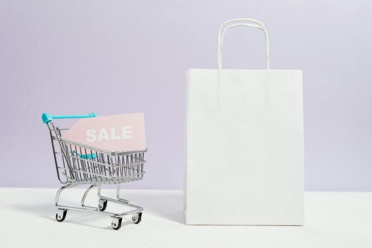 Photo by Karolina Grabowska: https://www.pexels.com/photo/sale-sign-in-a-miniature-shopping-cart-and-paper-bag-5632398/