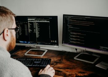 Photo by Lisa Fotios: https://www.pexels.com/photo/man-coding-on-computers-sitting-at-desk-16129703/