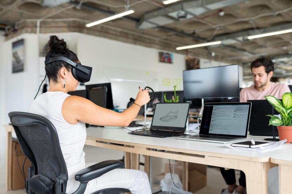 Photo by ThisIsEngineering: https://www.pexels.com/photo/woman-using-laptop-computer-with-vr-headset-3861458/