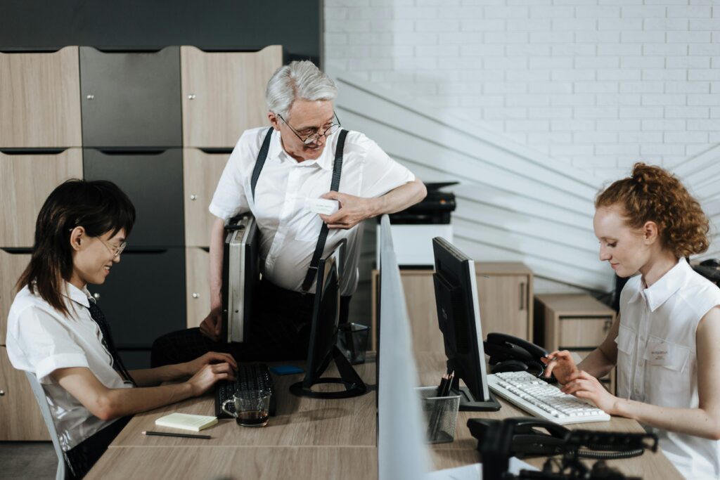 Photo by Ron Lach : https://www.pexels.com/photo/senior-man-talking-to-young-call-center-agents-8691842/