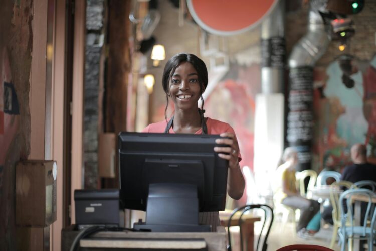Photo by Andrea Piacquadio: https://www.pexels.com/photo/cheerful-black-waitress-standing-at-counter-3801426/