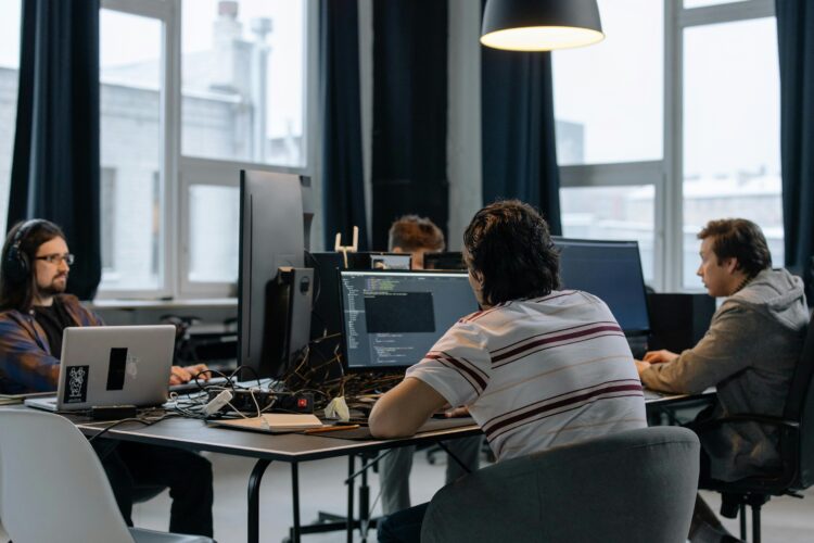 Photo by cottonbro studio: https://www.pexels.com/photo/men-sitting-at-the-desks-in-an-office-and-using-computers-6804068/