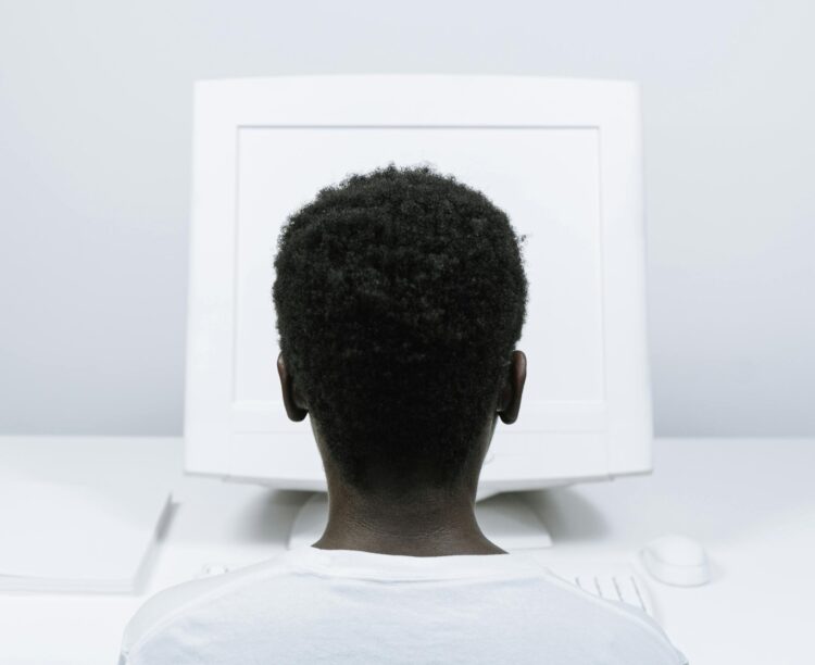Photo by cottonbro studio: https://www.pexels.com/photo/person-with-afro-hair-using-a-computer-5185177/
