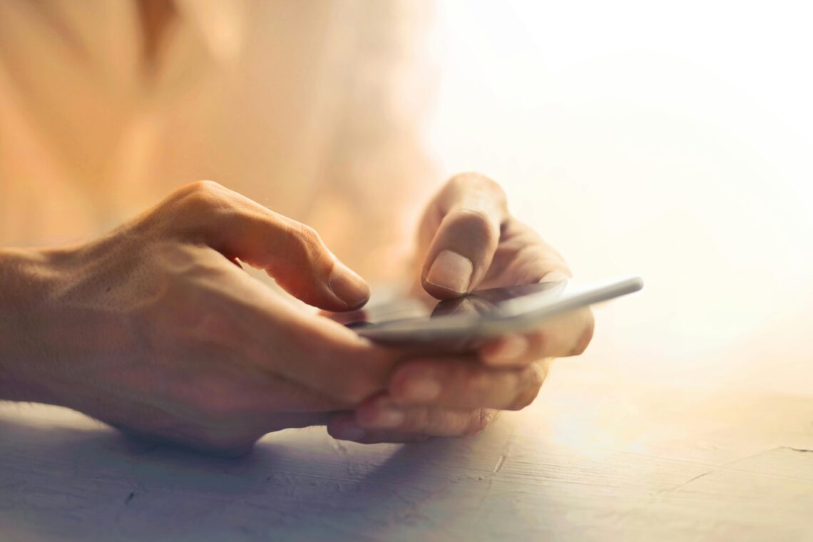 Photo by Andrea Piacquadio: https://www.pexels.com/photo/person-holding-white-smartphone-on-white-table-3766218/