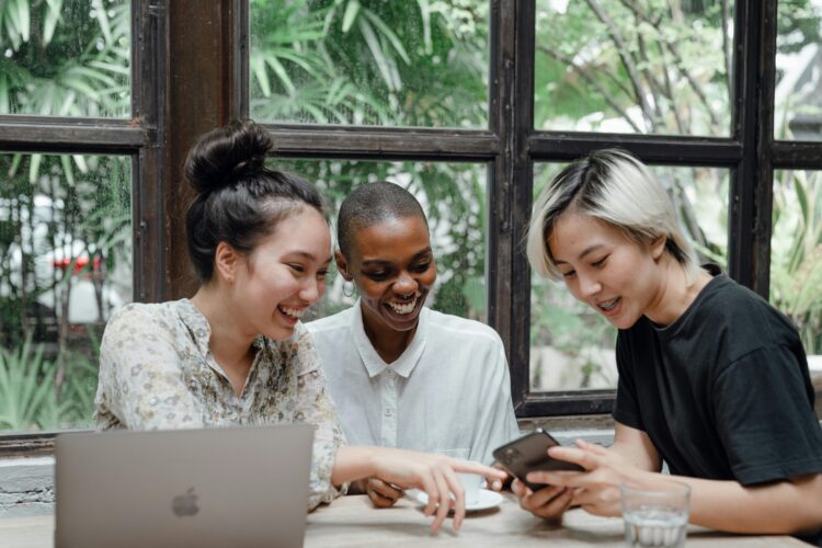 Photo by Ketut Subiyanto: https://www.pexels.com/photo/happy-multiethnic-women-having-fun-while-using-gadgets-in-cafeteria-4350210/