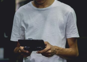 Photo by Nino Souza: https://www.pexels.com/photo/a-smartphone-game-controller-on-a-person-s-hand-2883029/